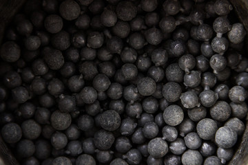 gray metal shot in tin on white background