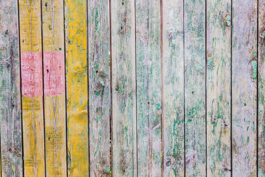 wooden fence painted in different color, wood texture © Людмила Ильина