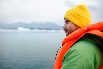 Huge arch of lava standing in the ocean. Icelandic landscape. Horizontal outside shot.