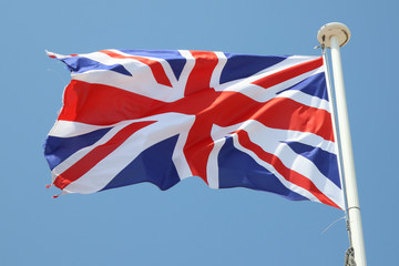 the English flag of the United Kingdom of England floats in the wind