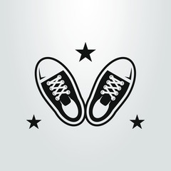 black and white simple flat art vector symbol of a pair of sneakers