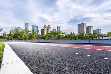 urban road with panoramic city skyline