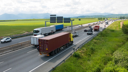 Car and trucks rushing on multiple lane highway at Turin bypass, Italy, one of the most important...