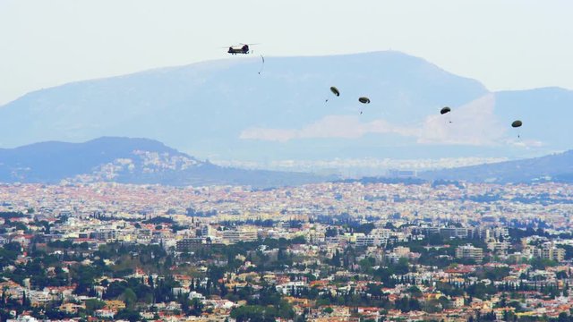 Chinook Helicopter Launches A Group Of Paratroopers During A Training Exercise Over Athens, Greece..