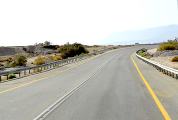 Road among beige mountains