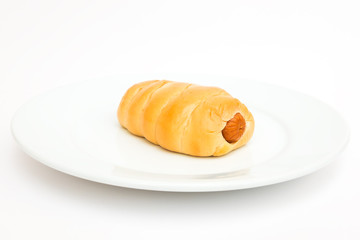 sausage bread roll on white plate