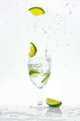 Lime pops from a glass with sparkling water