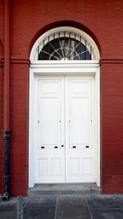 White Door in Red Building in the French Quarter