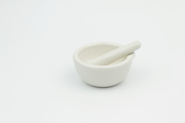 White porcelain mortar and pestle on isolated white background