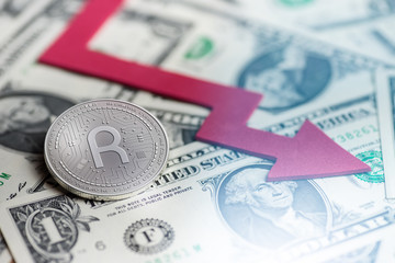 shiny silver RIVETZ cryptocurrency coin with negative chart crash baisse falling lost deficit 3d rendering