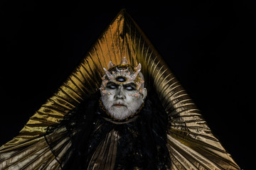 Creepy sea monster with thorns, dragon skin resting in his realm, almighty deity. Bearded man with...