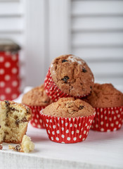 Fresh homemade delicious muffins with raisins on white background.  