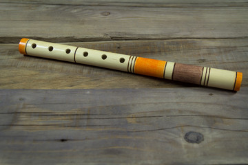 pipe wooden traditional musical wind instrument. wooden background © zoka74