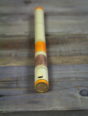 pipe wooden traditional musical wind instrument. wooden background