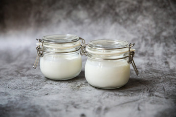 glass jar of yogurt milk