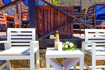 Terrace cafe with canopy. Decorative element. Interior decoration. Restaurant by the sea. Background. Nature. Water. Beach sand.