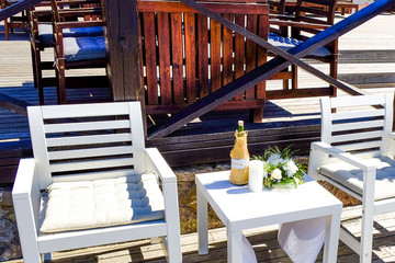 Terrace cafe with canopy. Decorative element. Interior decoration. Restaurant by the sea. Background. Nature. Water. Beach sand.