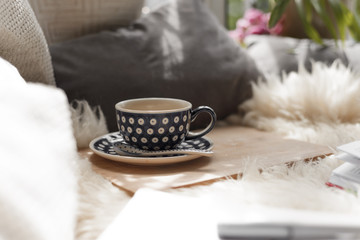 Fototapeta na wymiar Coffee cup at blanked bed
