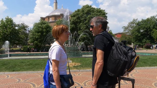 mature travelers couple contemplating the beauty of Sofia- mosque in background