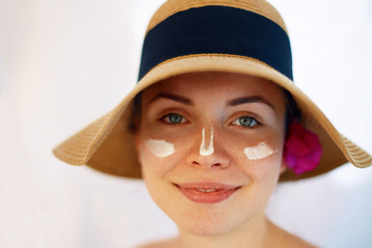 Suntan Lotion Woman Applying Sunscreen. Solar Cream.