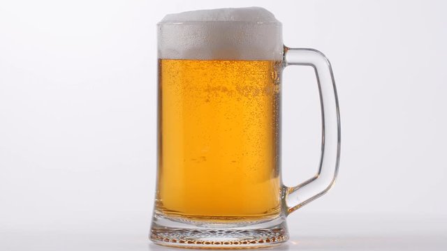 Pouring Glass of light beer