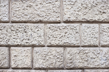 Stone wall on the facade of the building - a nice stone texture