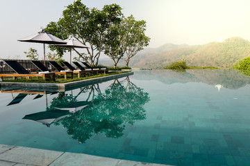 Obraz premium Swimming pool terrace with mountain view