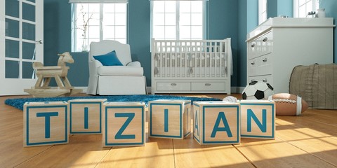 The name tizian written with wooden toy cubes in children's room