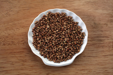 Buckwheat grains on ceramic plate