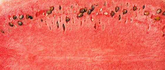 Juicy ripe watermelon texture. Ripe juicy summer fruit watermelon texture, wallpaper and background, top view.