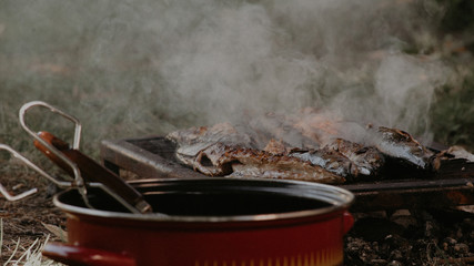 making fish food outside on barbecue 