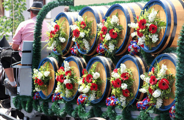 horse drawn carriage with decorated Bavarian beer barrels and coachman