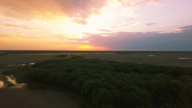 4k.Aerial. Landscape with wood  and beautiful  color sky  in sunset time