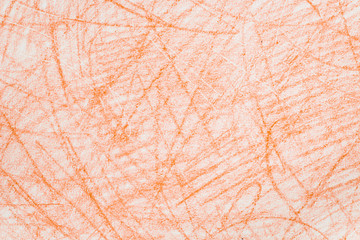 orange crayon doodles on paper background texture