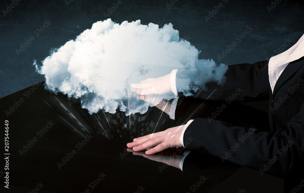 Poster male hands touching interactive table with a white cloud on it