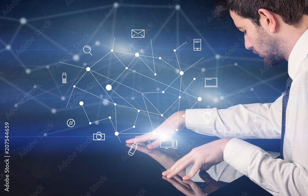 Poster male hands touching interactive table with blue mixed communication icons in the background