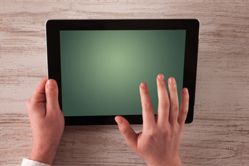 Caucasian business hands holding and working on plain tablet