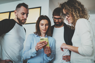 Business meeting concept.Coworkers team working with mobile devices at modern office.Blurred background.