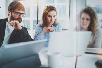Business meeting concept.Coworkers team working with mobile computer at modern office.Blurred...
