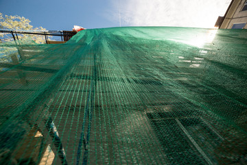 Scaffolding on five-story building. Renovation concept