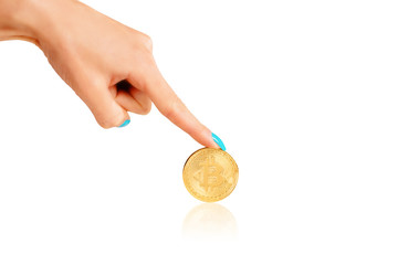 Plakat Female hand pointing to coin bitcoin.