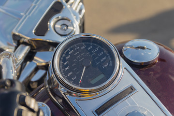 Speedometer, steering wheel and gas tank beautiful classic motorcycle. Transport