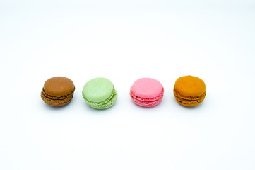 macarons isolated on white background, sweet colorful macarons in row