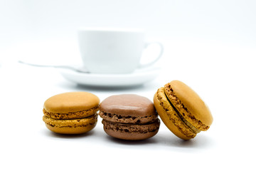 Cup of coffee with macarons isolated on white background