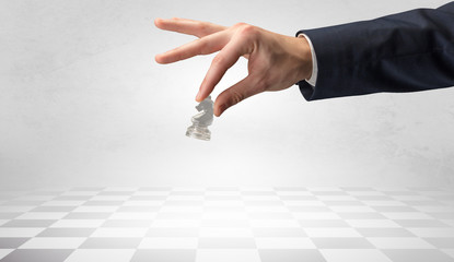 Big elegant hand taking his next step on chess game
