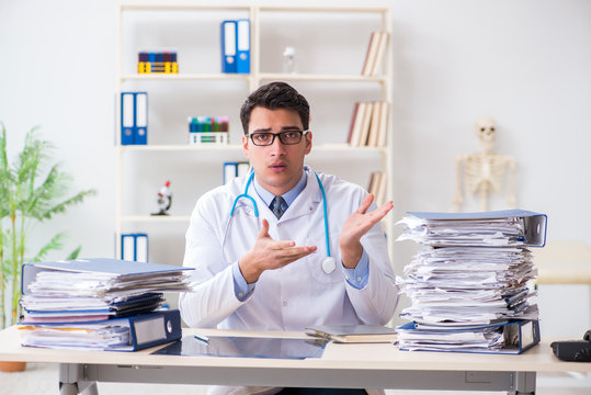 Busy doctor with too much work in hospital