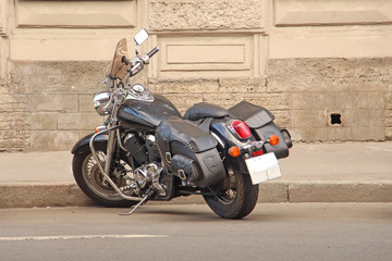 Fototapeta na wymiar parked motorcycle by the sidewalk