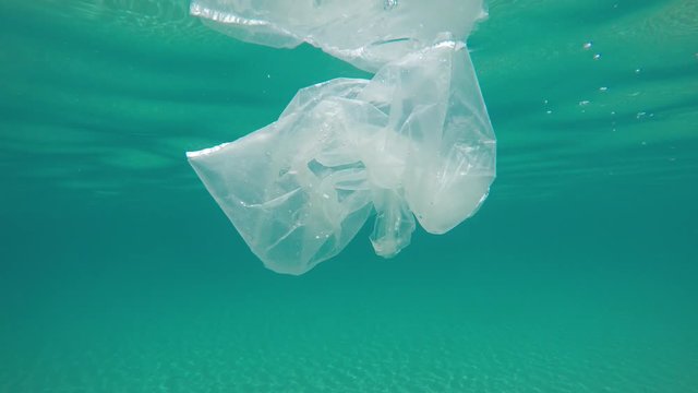 used plastic package in the sea