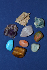 Minerals and precious stones on a blue background. Top view