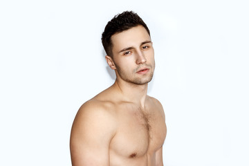 Fototapeta premium Sport guy with white towel on white background